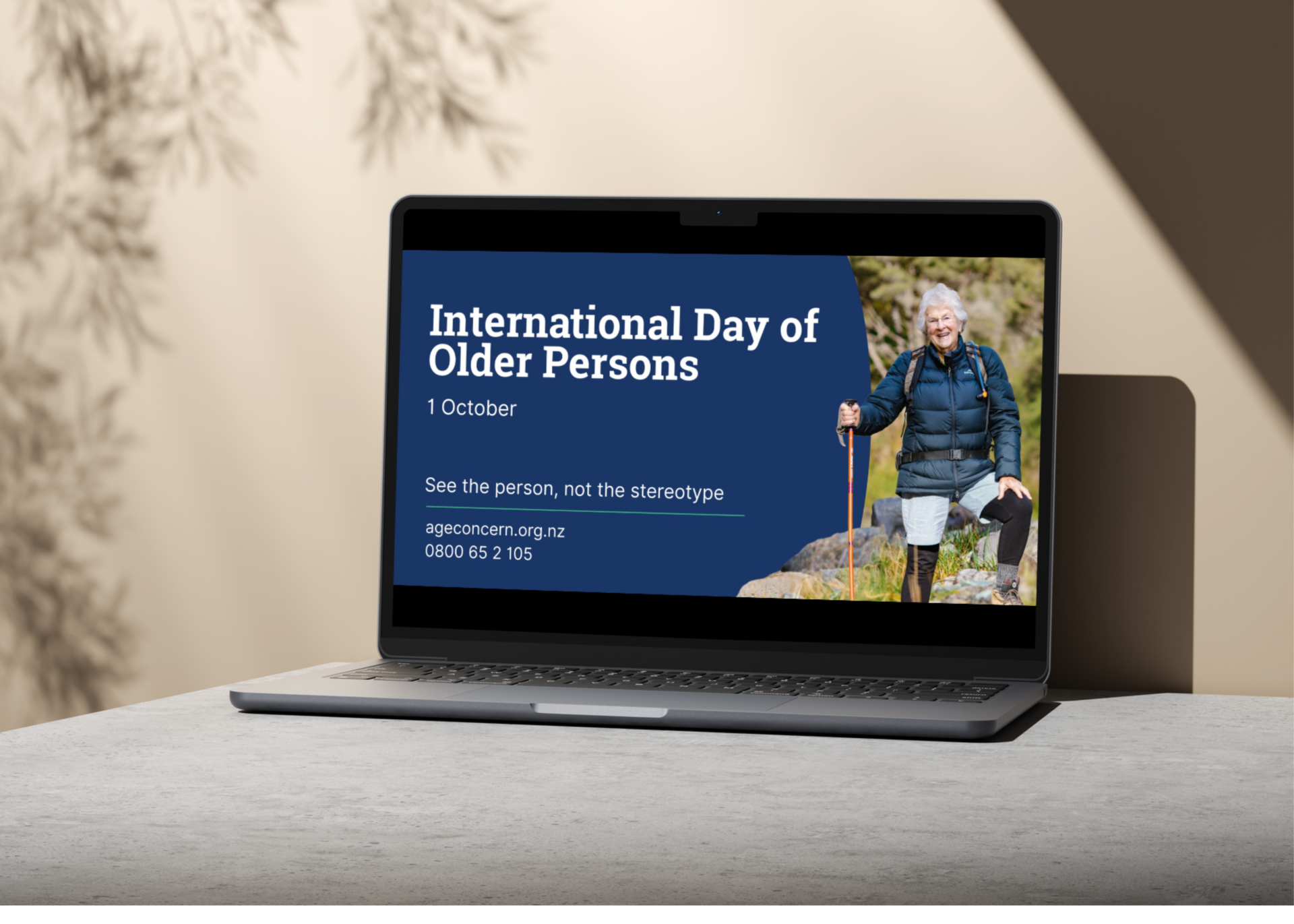 Laptop showing older person hiking beside the words 'International Day of older persons'