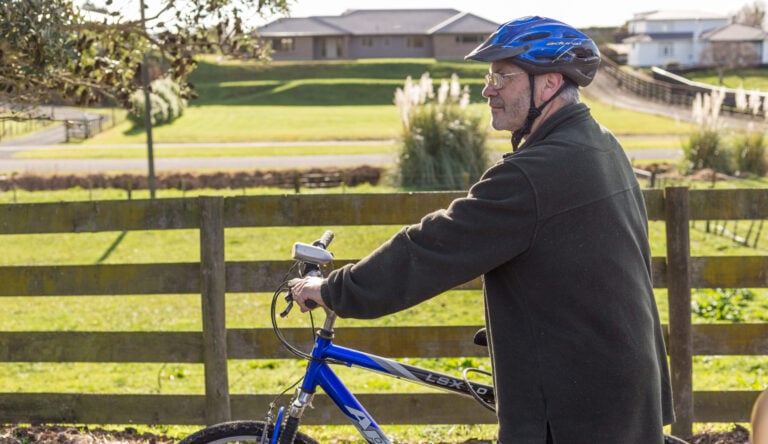 man with bicycle representing someone keeping the brain active
