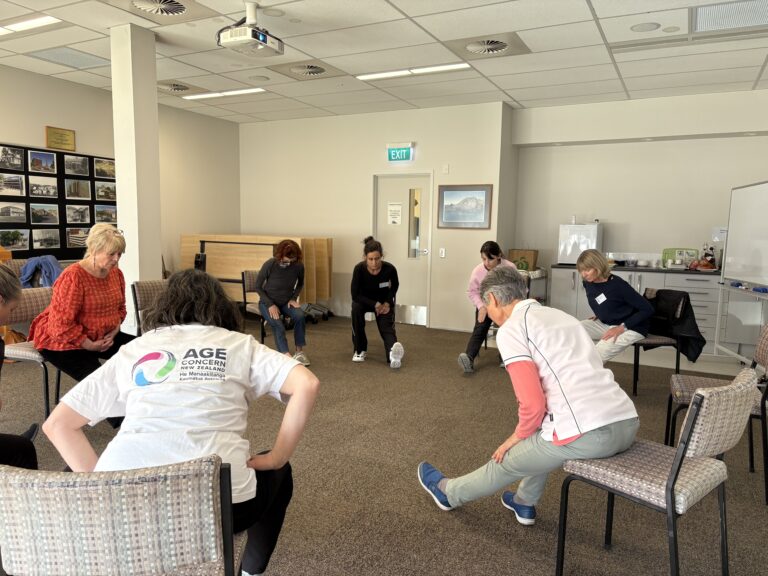 Adults doing exercise while sitting