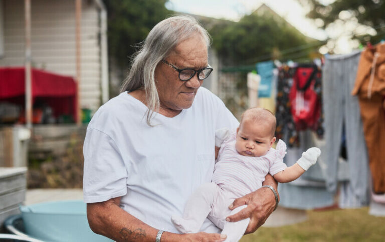 Older adult carrying baby