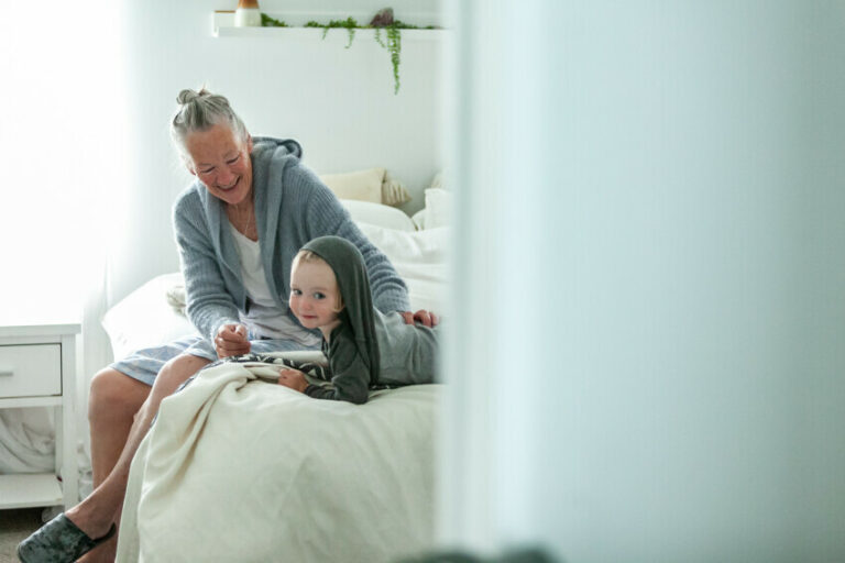 Older adult with young grandchild